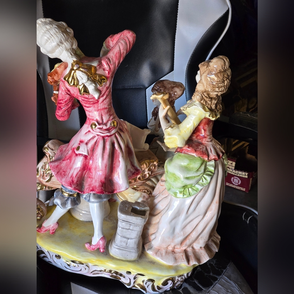 Vintage Porcelain Figurine with Red and Green Accents